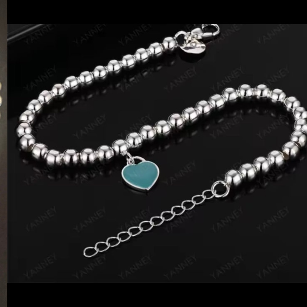 Beautifully Crafted Silver Balls Bracelet With Heart Pendant